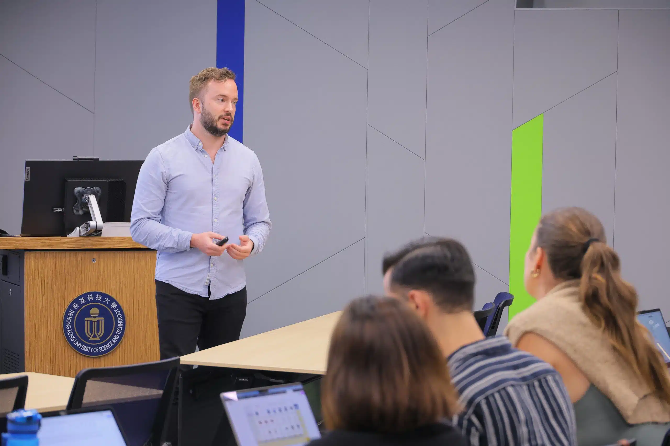 the image shows the consulting coach florian smeritschnig holding a lecture in front of a cems student audience at the hong kong university of science and technology