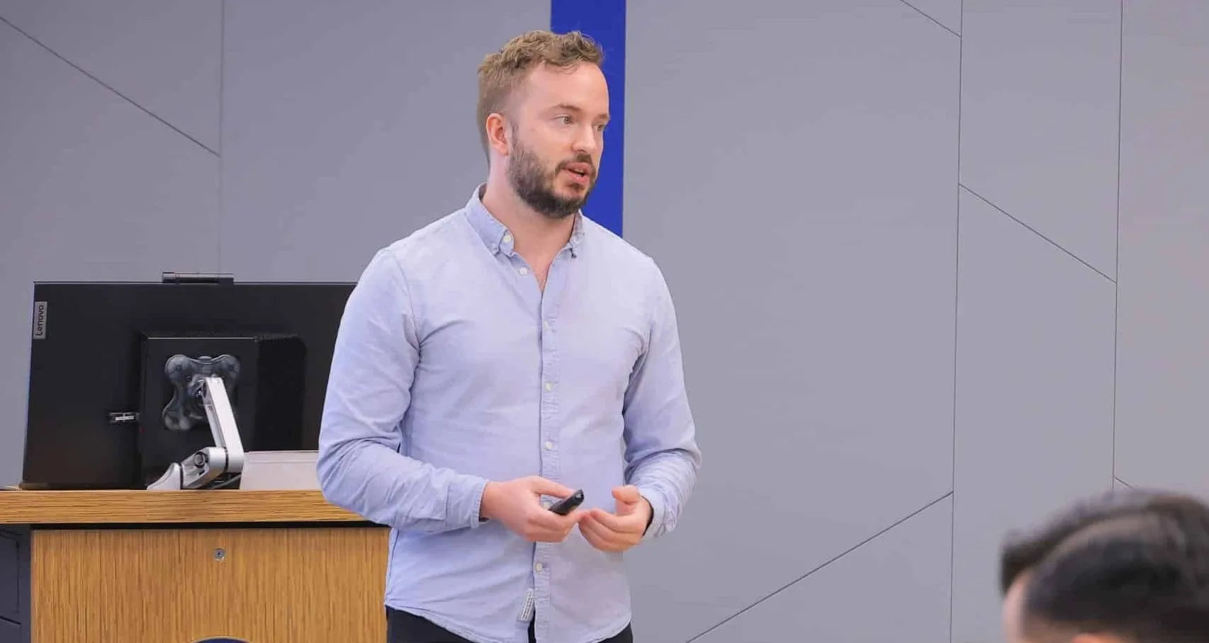 the image shows the consulting coach florian smeritschnig holding a lecture in front of a cems student audience at the hong kong university of science and technology